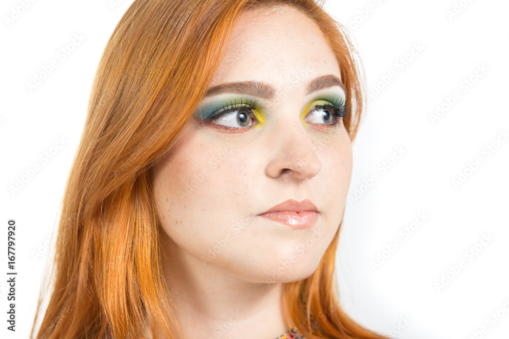 Woman looks sideways, profile. Redheaded girl wearing colorful yellow dress. Summer.. Woman looks sideways, profile. Redheaded girl wearing colorful yellow dress. Summer..