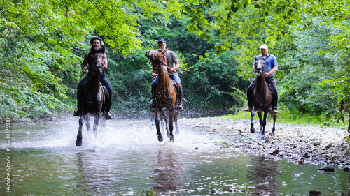 Horse riding on the river
