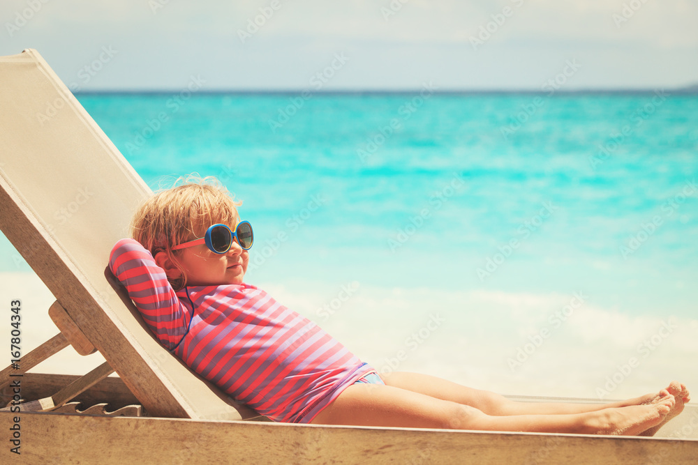 little girl relaxed on summer beach