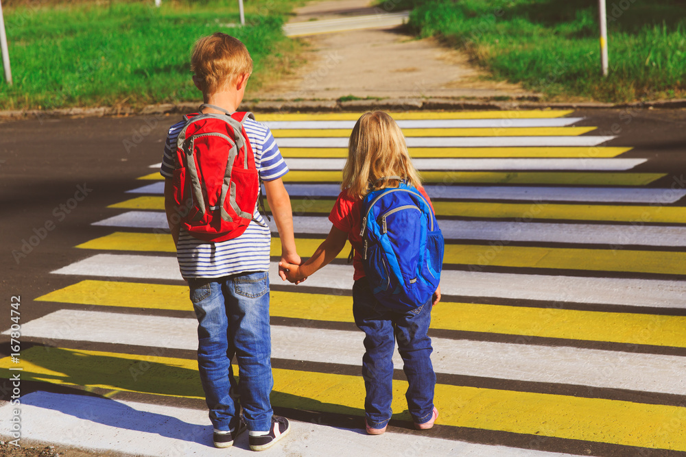 little boy and girl holding hands go to school little boy and girl holding hands go to school