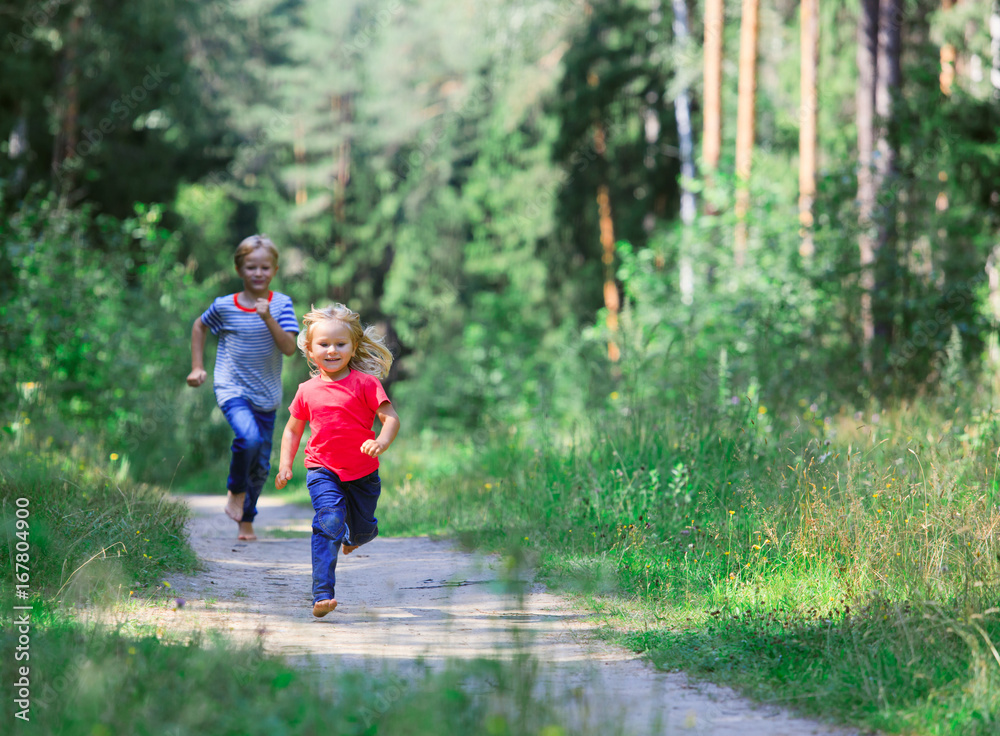 happy little girl and boy run play in summer nature happy little girl and boy run play in summer nature