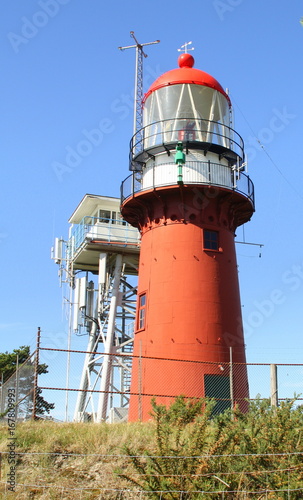 Red lighthouse on the island Vlieland. The Netherlands photo