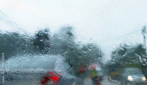 View From The Car Glass On The Rainy Day With Motion Blur Effect And Selective Focus