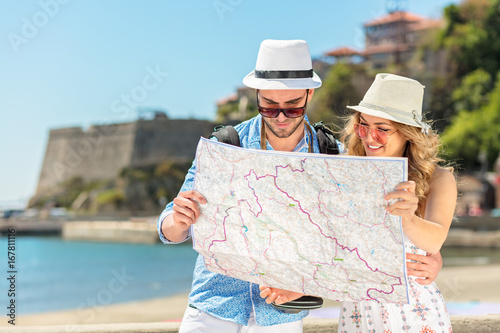 Couple tourist traveling and using map. Couple tourist exploring a city.