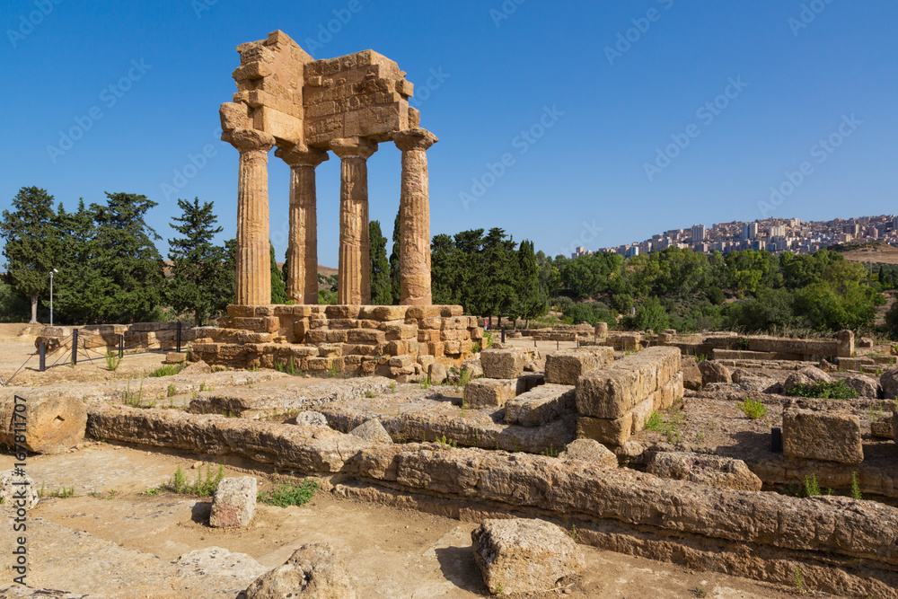 Agrigento, Italy -  Tempio dei Dioscuri. Valley of the Temples is an archaeo site in Sicily, southern Italy. The area was included in the UNESCO World Heritage Site list in 1997.