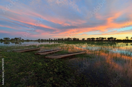 Mokoro in the Okavango delta at sunset  Botswana