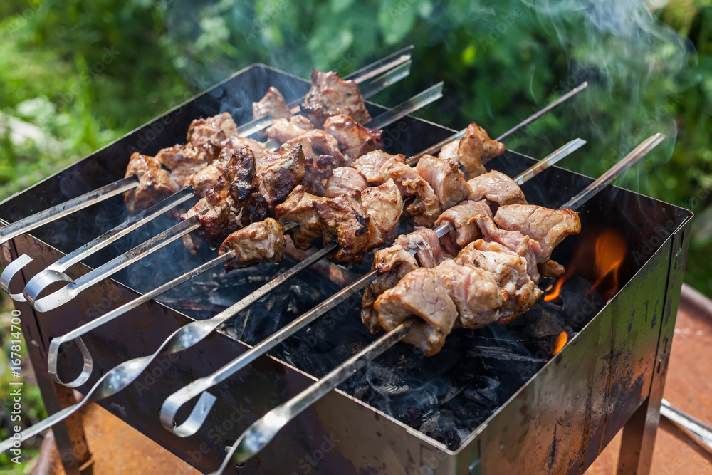 The shish kebab is fried on the grill