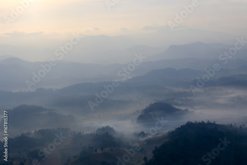 aerial view blurred mountain range cover by fog at dawn in Thailand