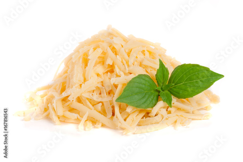 Heap of grated cheese with basil leaves isolated on white background