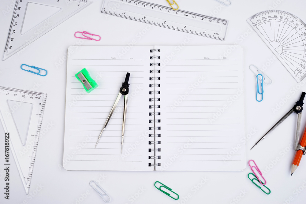 Back to School concept. Studying elements on a white background in a top view or flat lay Back to School concept. Studying elements on a white background in a top view or flat lay