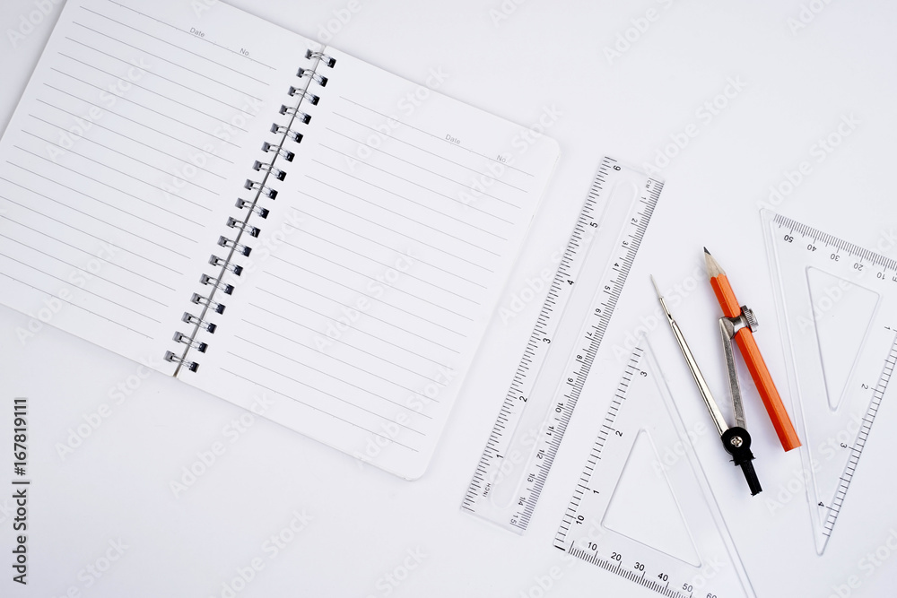 Back to School concept. Studying elements on a white background in a top view or flat lay Back to School concept. Studying elements on a white background in a top view or flat lay