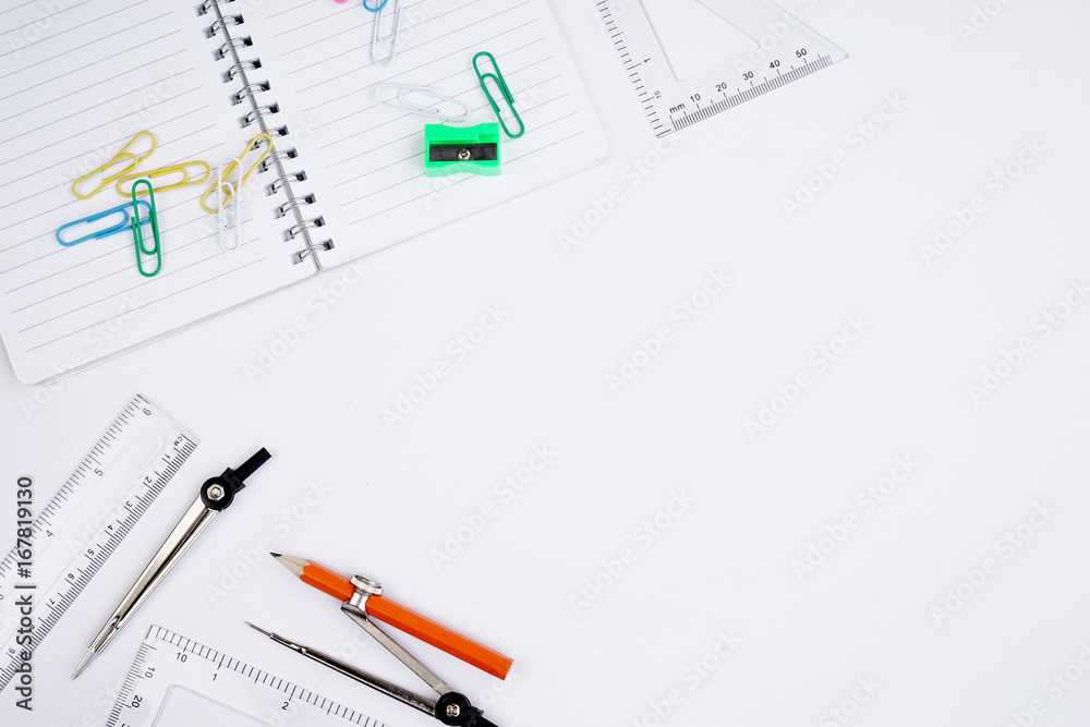 Back to School concept. Studying elements on a white background in a top view or flat lay Back to School concept. Studying elements on a white background in a top view or flat lay