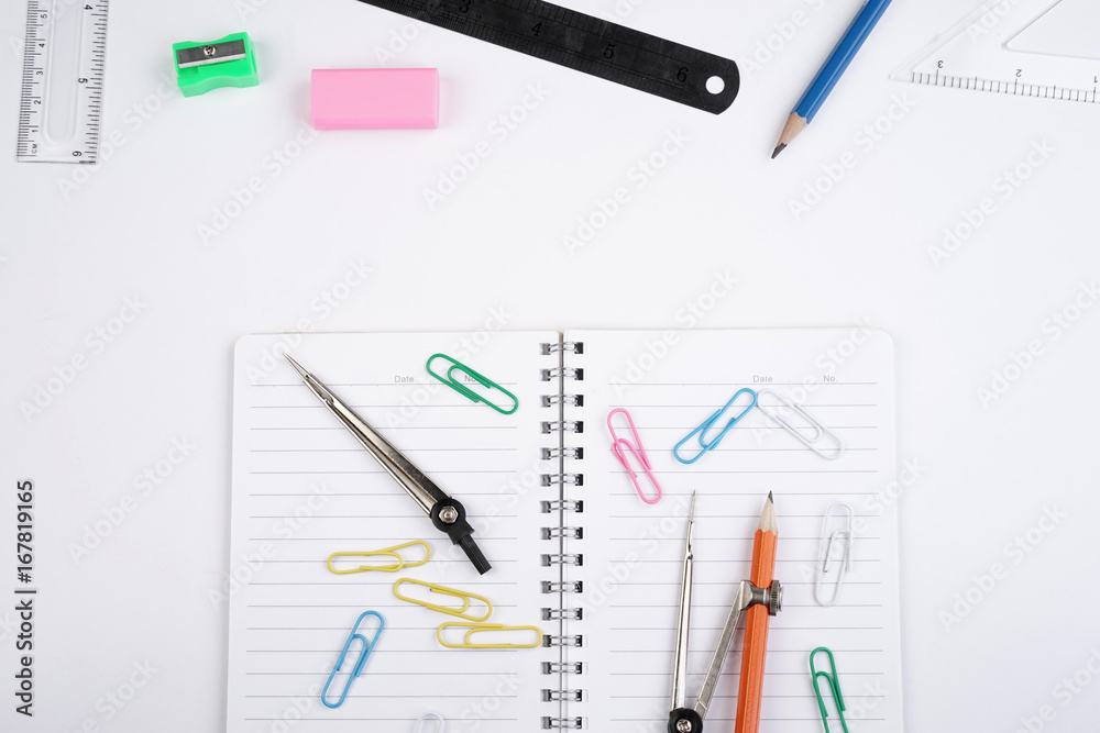 Back to School concept. Studying elements on a white background in a top view or flat lay Back to School concept. Studying elements on a white background in a top view or flat lay
