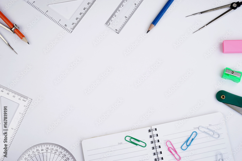 Back to School concept. Studying elements on a white background in a top view or flat lay Back to School concept. Studying elements on a white background in a top view or flat lay