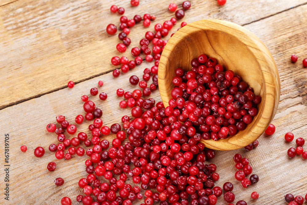 Cranberries in a plate and scattered Cranberries in a plate and scattered