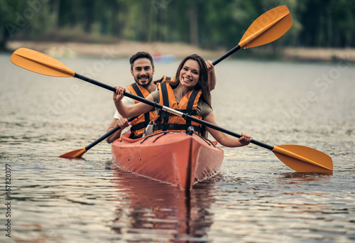 Couple travelling by kayak photo