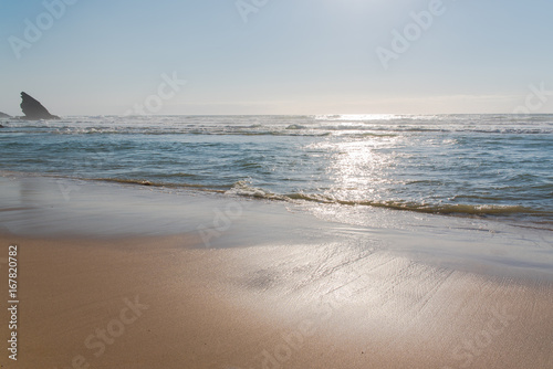Portugal, beach, beautiful seascape in the evening, sunset with sea spray 