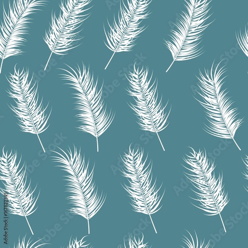 Seamless pattern with tropical leaves on blue background