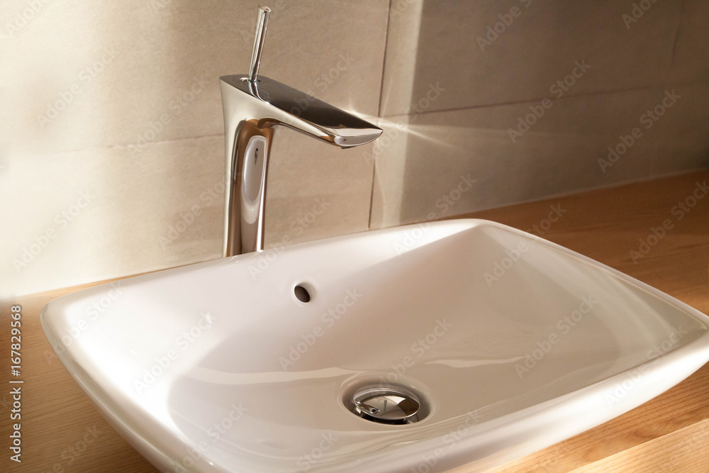 CLose up white comtemporary luxury washbasin, tap CLose up white comtemporary luxury washbasin, tap