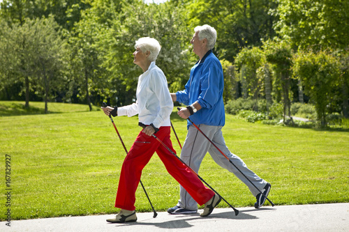 Senior couple doing Nordic walking photo