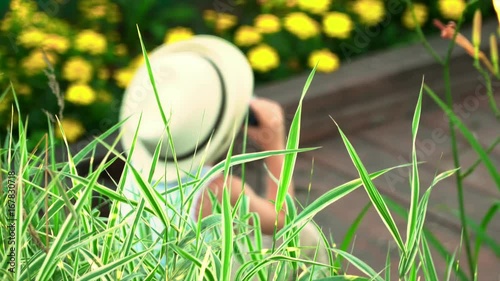 The boy looks in the field-glass in a lake distance. Summer type of rest.