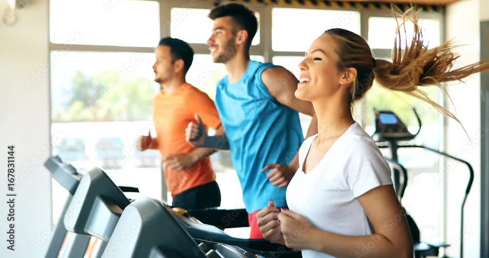 Group of friends exercising on treadmill machine Group of friends exercising on treadmill machine