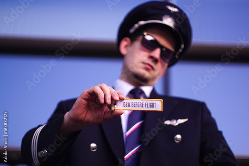 Pilot holds a keychain photo