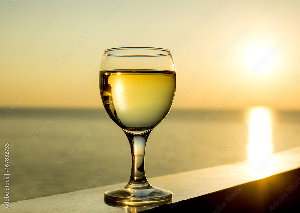 glass of wine at sunset