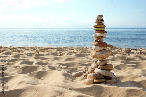 tower of rocks on beach