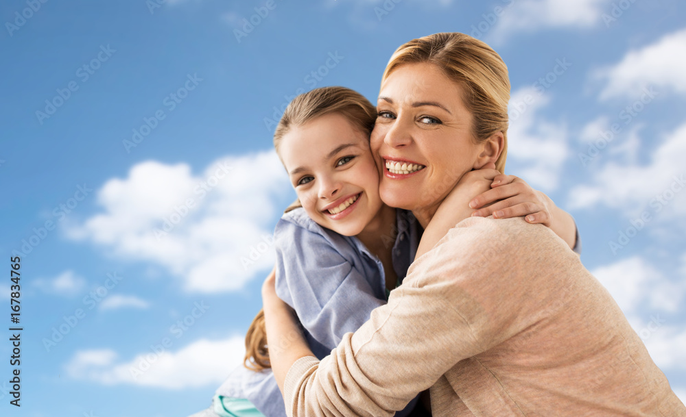 happy family of girl and mother hugging over sky happy family of girl and mother hugging over sky