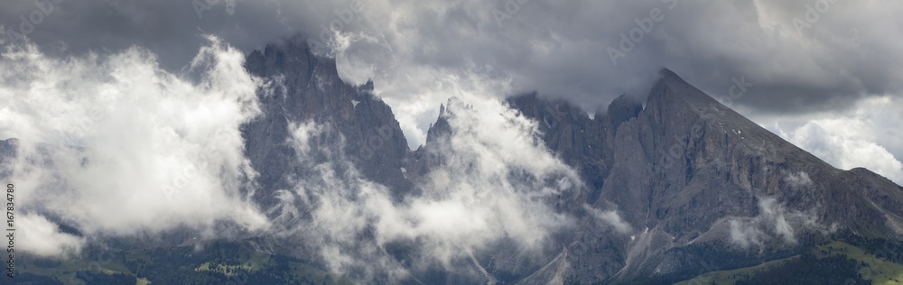 panorama of Dolomite rocks in clouds in Italy panorama of Dolomite rocks in clouds in Italy
