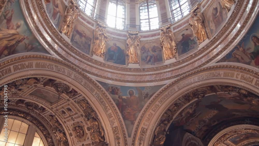 Wall paintings with religious themes in the old Orthodox church. Pan up from the walls to the dome of the temple. Wall paintings with religious themes in the old Orthodox church. Pan up from the walls to the dome of the temple.
