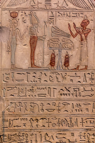 Hieroglyphic carvings on the exterior walls of an ancient egyptian temple