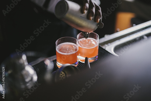 Pouring Cocktails at the bar photo