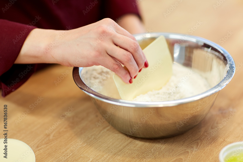 Fototapeta premium chef with flour in bowl making batter or dough