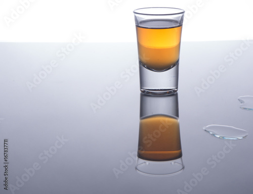 Whisky shot glass with reflections