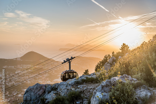 Cable car moving to the summit of Mount Srd for tourists to enjoy the view of Dubrovnik, Croatia during sunset