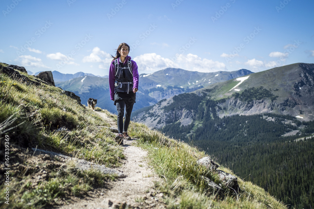 Woman Walking in Mountains