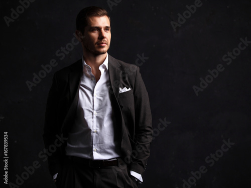 Elegant young handsome man. Studio fashion portrait