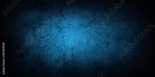 Blue concrete wall background. Dark edges