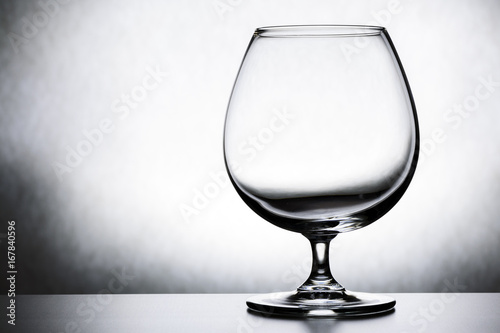 Single empty brandy glass on white background. photo