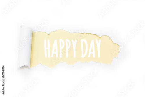 Isolated inscription "happy day" on a yellow background, tearing paper.