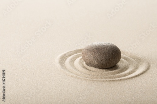Stone on sand.