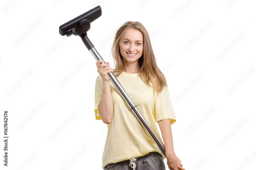 Beautiful young girl in home clothes with a vacuum cleaner on a white background isolation