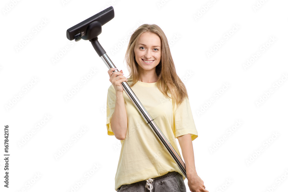 Beautiful young girl in home clothes with a vacuum cleaner on a white background isolation Beautiful young girl in home clothes with a vacuum cleaner on a white background isolation