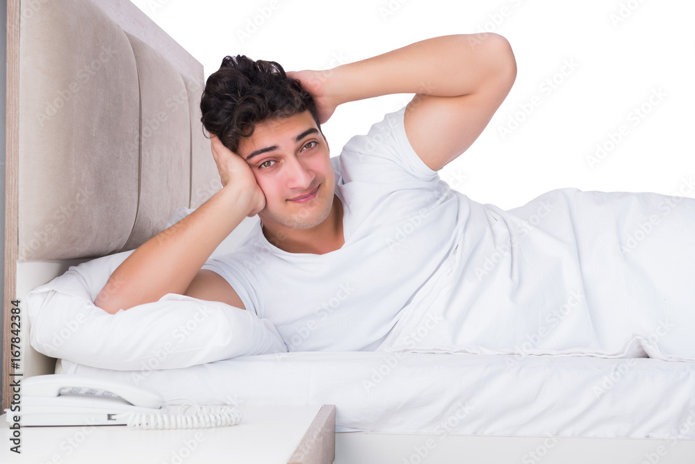 Man in bed suffering from insomnia Man in bed suffering from insomnia