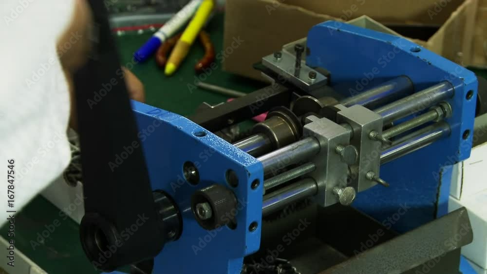 Person adjusts machine in factory, close up Person adjusts machine in factory, close up