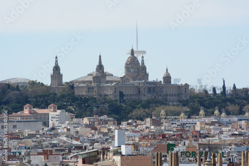 Panoramic view of barcelona from a rooftop with mount montjuit in background