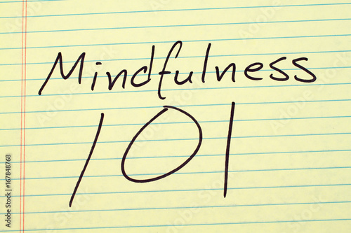 The words "Mindfulness 101" on a yellow legal pad