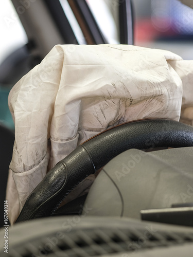 Car interior with the opened air bag
